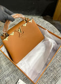 Louis Vuitton Capucines Bag in Brown Textured Leather
