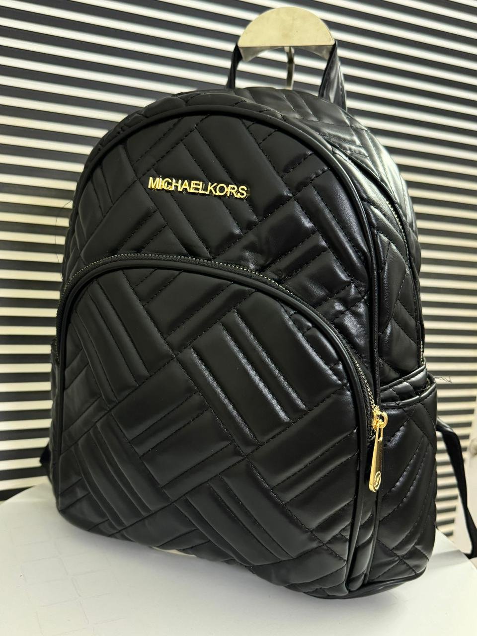 Michael Kors Leather Backpack in Black.