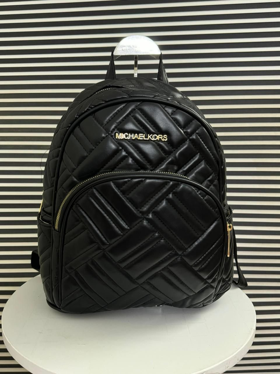 Michael Kors Leather Backpack in Black.