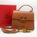 Valentino Garavani Small Handbag in Brown