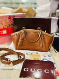 Gucci GG Emblem Leather Bag in Brown