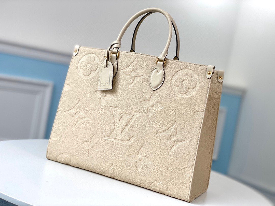 Louis Vuitton On-the-Go GM Handbag in Beige
